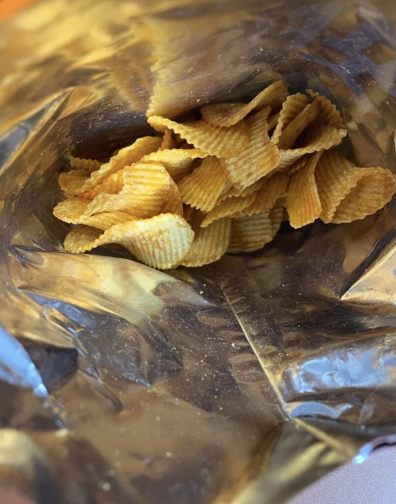 a view of the potato chips k-yangnyeom chicken inside the bag, offering a helpful look for people searching where to buy korean snack and wanting to see the actual contents