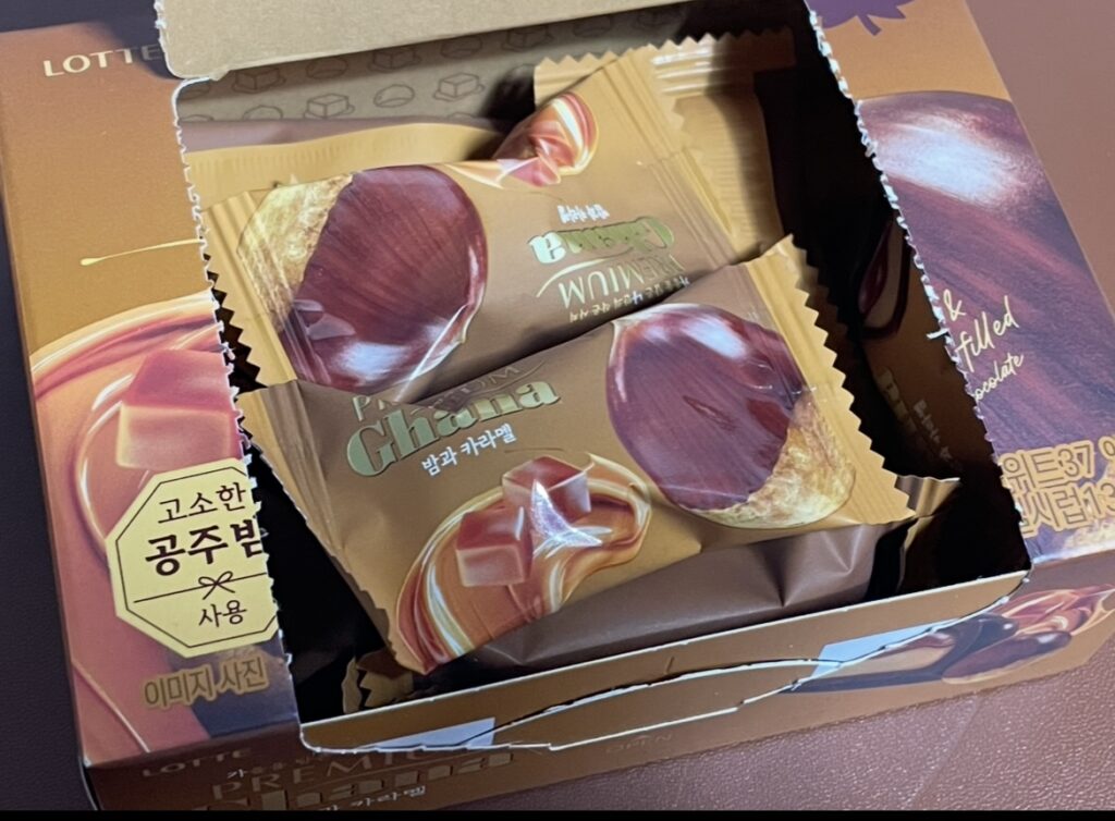when the box is opened, individually wrapped chocolates are neatly arranged inside. this scene shows the actual contents and is useful for people searching where to buy korean snack product