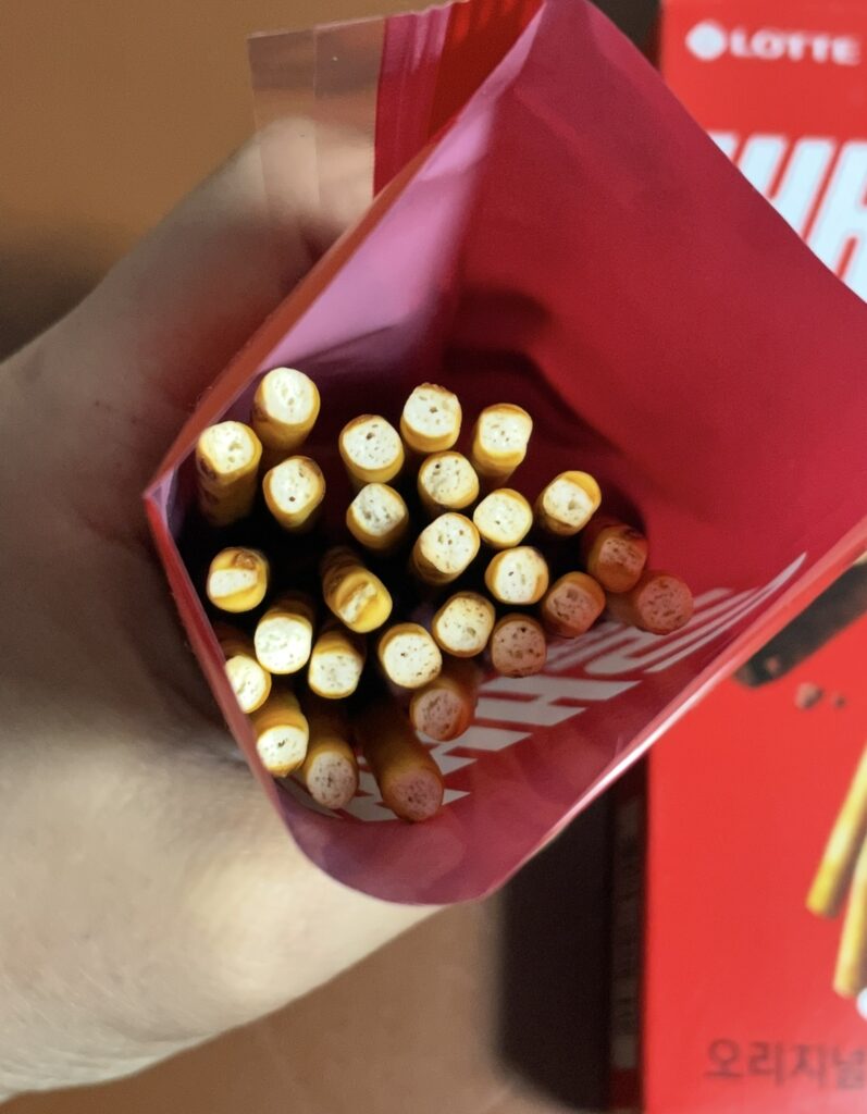 Pepero Original sticks arranged inside the opened bag, giving a realistic look for anyone searching Where to buy Korean snack and checking the actual contents