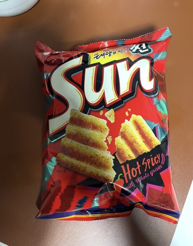 Front package of Sun Chips Spicy, featuring a bold red design and chili icons that highlight the snack’s spicy flavor