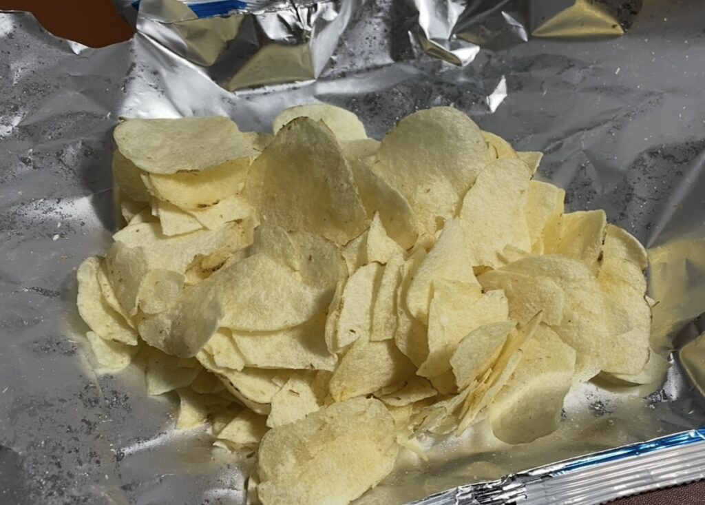 Thinly fried potato chips spread across the packaging surface. The texture and color show how authentic it looks, perfect for those searching Where to buy Korean snack