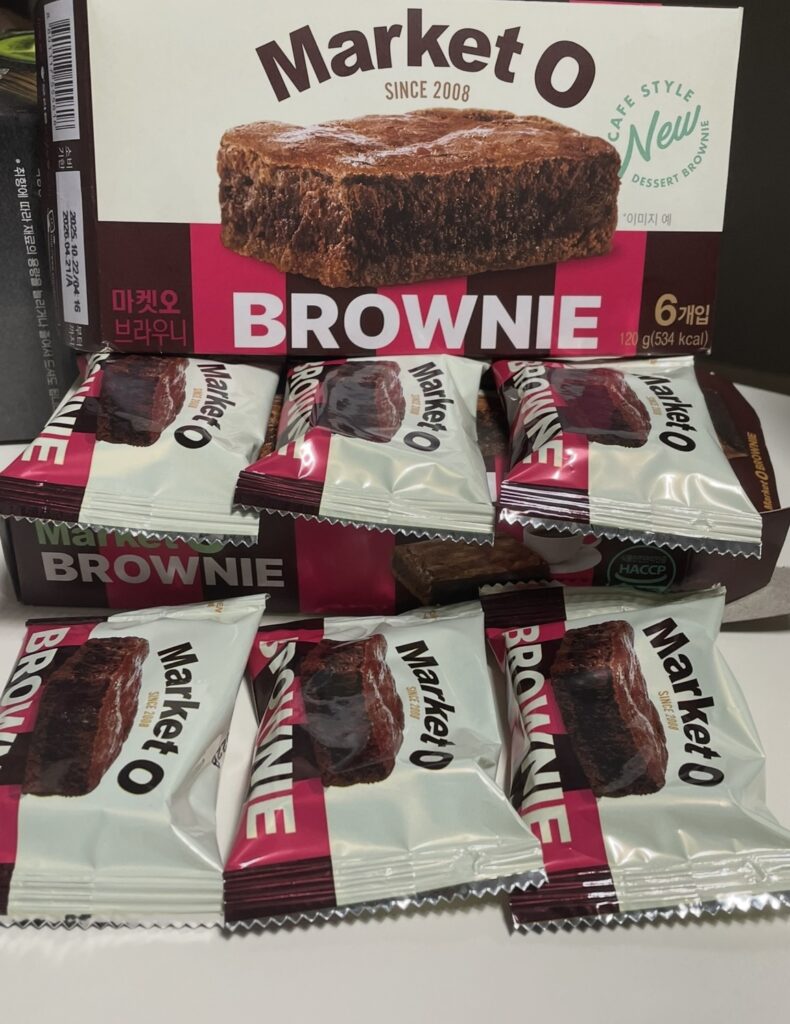 the large box is filled with individually wrapped packets of brownies. this is the type of packaging frequently checked by people looking for where to buy korean snack