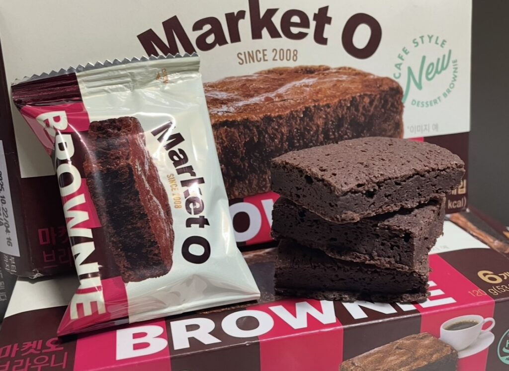 a view of a single brownie packet torn open and spread out. it suggests the dark chocolate korean snack flavors