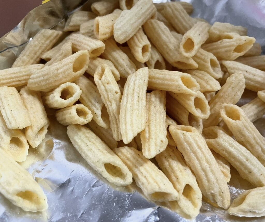 a close-up shot of the ganjjam pepper snack highlighting its crisp coating and dense texture, offering detailed visuals suitable for a korean snack review