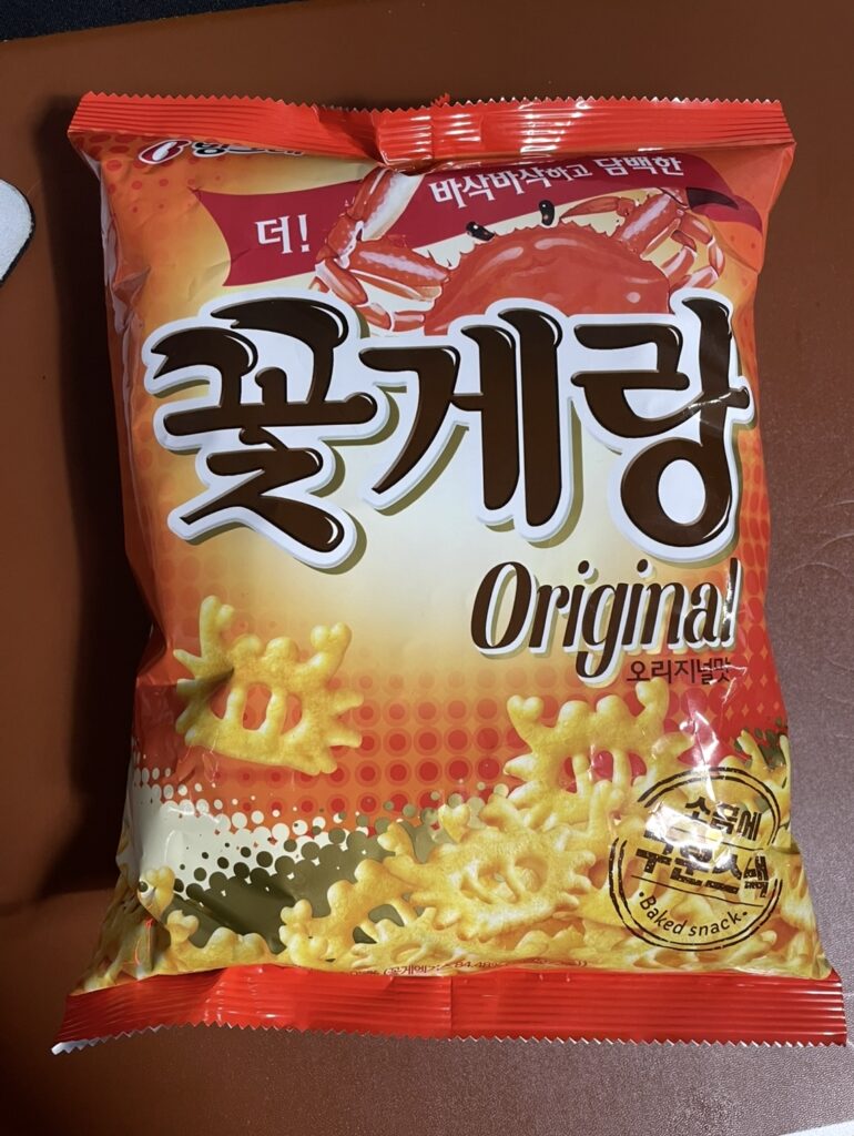 The front package of the kkotgerang original product. It features a large crab illustration on a red and orange background.