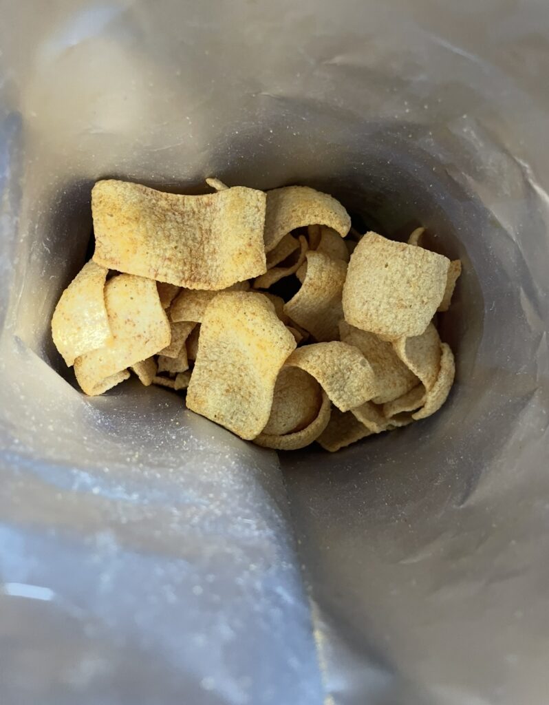 
An opened bag showing the chips inside, providing a realistic look at the quantity and shape for those searching where to buy korean snack