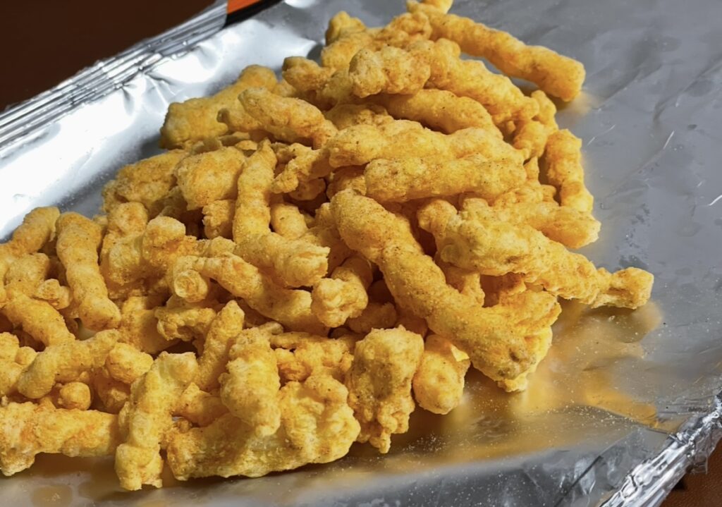 a detailed close-up of a single snack piece, showing surface texture and seasoning, useful for people reading a korean snack review and imagining the taste